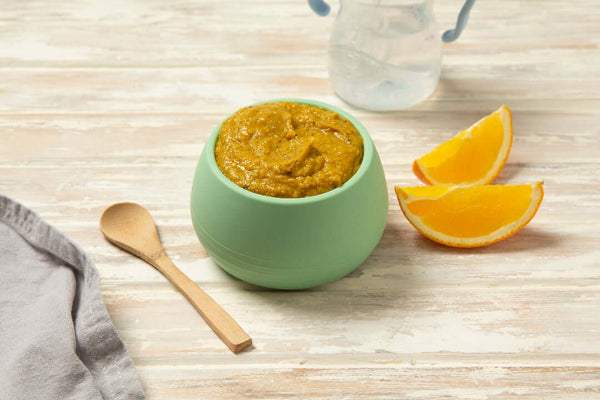 Baby Food puree in a green bowl with orange