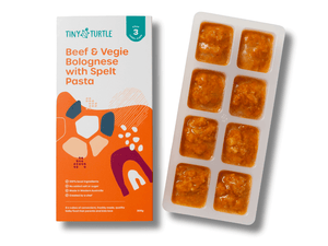Tiny Turtle baby food packaging with a tray of baby food cubes on a white background