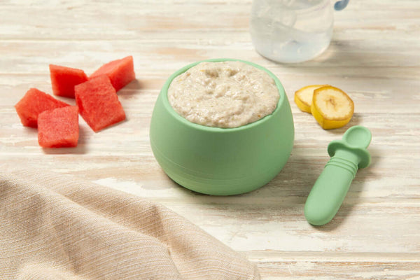 Baby food chia pudding in a green bowl