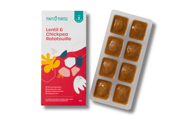 Stage 2 Lentil and Chickpea Ratatouille baby food by Tiny Turtle, featuring 8 frozen puree cubes in tray next to product packaging.
