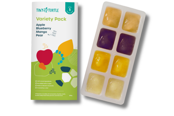 Tiny Turtle variety pack with colorful fruit-shaped ice cube trays on a white background