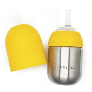 Yellow sippy cup with a stainless steel base on a white background