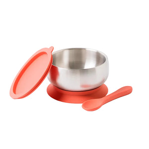 Stainless steel bowl with coral lid and spoon on a white background