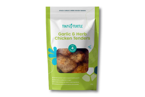 A stand-up pouch of Tiny Turtle Garlic & Herb Chicken Tenders on a plain white background. The packaging is lime green and white with a clear window showing the chicken tenders inside.