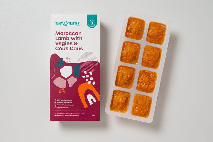 Moroccan Lamb stage 3 baby puree with 8 frozen cubes next to packaging