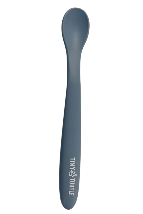 Blue spoon with 'Tiny Turtle' branding on a white background