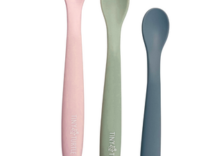 Three colorful spoons with 'Tiny Turtle' branding on a white background