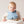 Bbox silicone bib on a baby in a high chair, designed to catch food, made of non-toxic silicone, easy to clean.