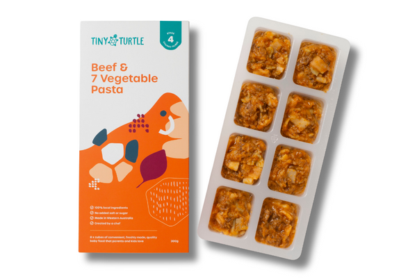 Tiny Turtle food packaging with a tray of pre-made meals on a white background
