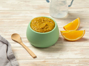Baby Food puree in a green bowl with orange