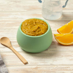 Baby Food puree in a green bowl with orange