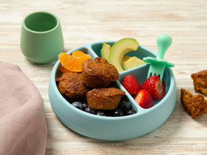 Blue baby bowl with Tiny TurtleCarrot Banana and chia muffins, strawberries and avocado. 