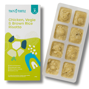 Tiny Turtle baby food packaging with chicken, veggie, and brown rice risotto on a white background