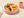 Toddler food egg bites on a pink plate with cucumber and banana