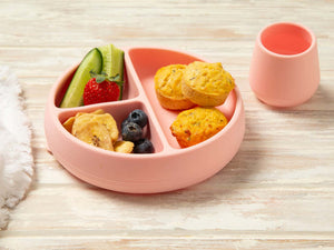 Toddler food egg bites on a pink plate with cucumber and banana