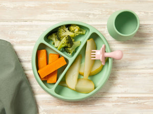 First Finger Food Pack with steamed pumpkin batons, broccoli florets, and pear pieces on a green plate.