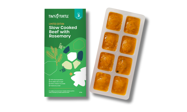 Tiny Turtle baby food package with frozen cube trays on a white background
