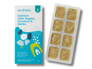 Salmon with vegies coconut and herbs Stage 3 baby food by Tiny Turtle, featuring lumpy textured puree in tray next to packaging.