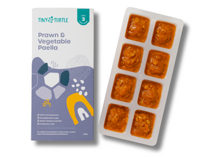 Prawn & Vegetable Paella packaging and tray with food on a white background