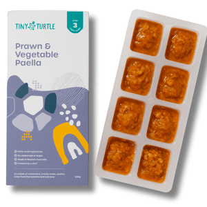 Prawn & Vegetable Paella packaging and tray with food on a white background