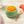 Load image into Gallery viewer, Bowl of stage 3 summer mango chicken with brown rice baby food with lumpy puree with watermelon pieces on a wooden surface.
