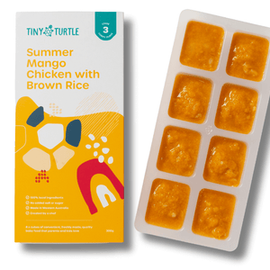 Tiny Turtle baby food packaging with a tray of yellow baby food cubes on a white background