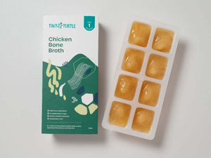 Tiny Turtle Chicken Bone Broth showing 8 frozen cubes next to the packaging 