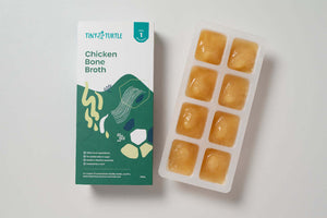 Tiny Turtle Chicken Bone Broth showing 8 frozen cubes next to the packaging 