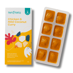 Tiny Turtle baby food packaging with chicken and mild coconut curry on a white background