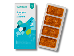 Tiny Turtle baby food packaging with frozen food in a tray on a white background