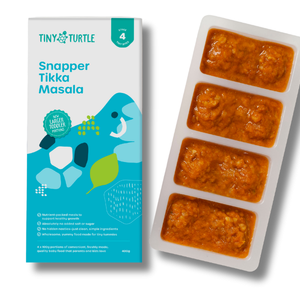 Tiny Turtle baby food packaging with frozen food in a tray on a white background