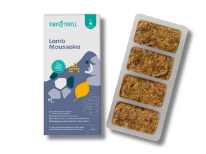 Tiny Turtle Lamb Moussaka baby food packaging and tray on a white background