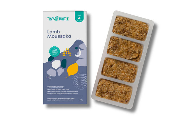 Tiny Turtle Lamb Moussaka baby food packaging and tray on a white background