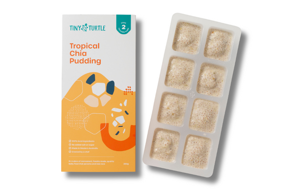 Tropical Chia Pudding packaging and a tray of chia pudding cubes on a white background