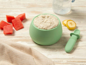 Baby food chia pudding in a green bowl