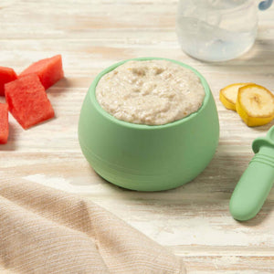 Baby food chia pudding in a green bowl