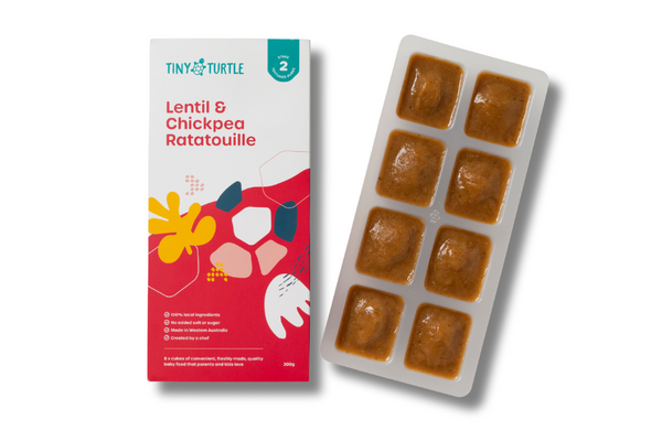 Stage 2 Lentil and Chickpea Ratatouille baby food by Tiny Turtle, featuring 8 frozen puree cubes in tray next to product packaging.
